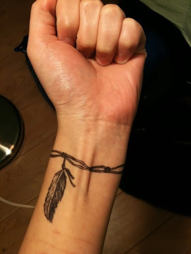 Left Wrist Black Tribal Tattoo